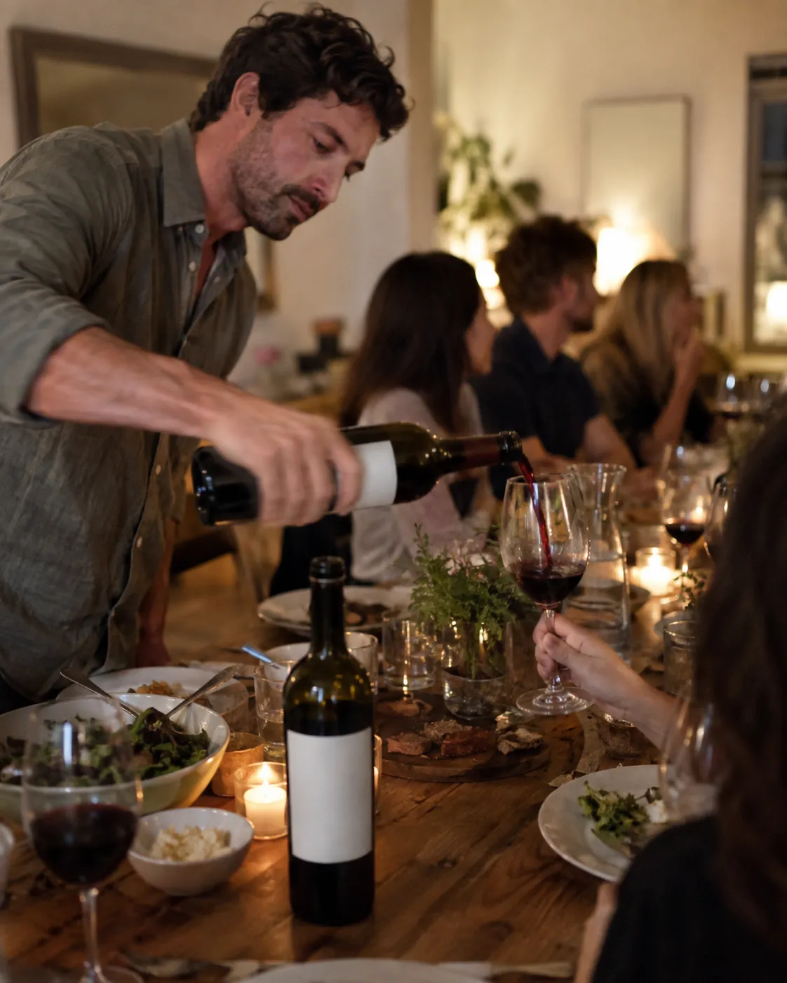 A person pouring wine
